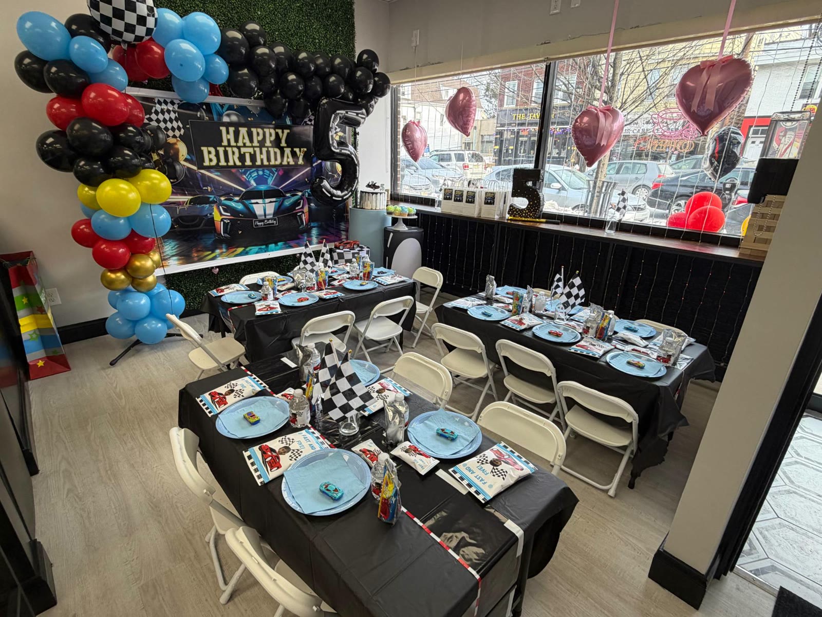Party tables set for a race car birthday at JJ's