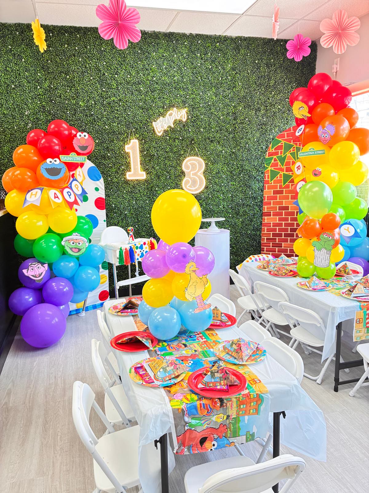 Sesame Street themed birthday party with rainbow balloons at JJ's